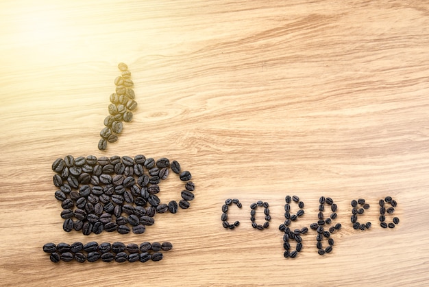 Foto café de palavra escrita com grãos de café