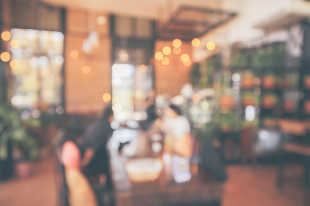 Café do restaurante ou interior da cafeteria com luz de bokeh abstrata estilo vintage desfocado do cliente