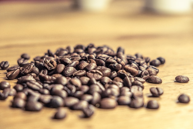 Foto caffee aislado frijoles de una mesa de madera