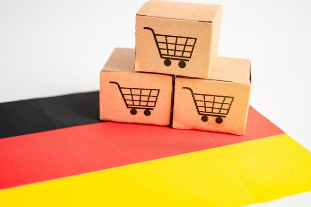 Caixa com logotipo de carrinho de compras e bandeira da Alemanha Importação Exportação Compras on-line ou eCommerce finança serviço de entrega loja conceito de fornecedor de comércio de transporte de produtos