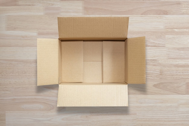 Foto caja de cartón marrón abierta vacía