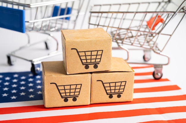 Caja con el logotipo del carrito de compras en línea y la bandera de EE. UU. América Importación Exportación Compras en línea o comercio finanzas servicio de entrega tienda producto envío comercio proveedor concepto