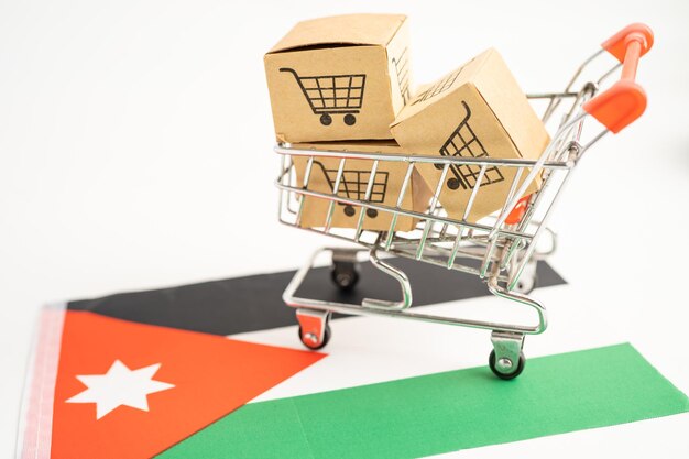 Caja con el logotipo del carrito de compras en línea y la bandera de Jordania Importación Exportación Compras en línea o comercio servicio de entrega de finanzas tienda producto envío comercio proveedor concepto