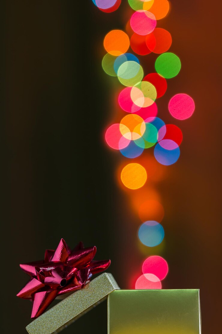 Foto caja de regalo con bokeh de colores