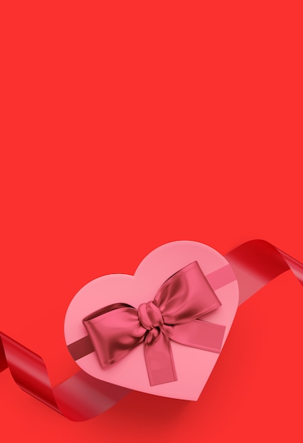 Caja de regalo en forma de corazón rosa y lazo rosa