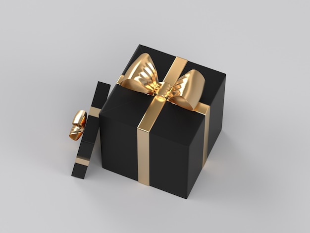 Una caja de regalo negra con un lazo dorado.