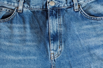 Calça jeans na frente com bolsos e braguilha, visão macro close-up | Foto