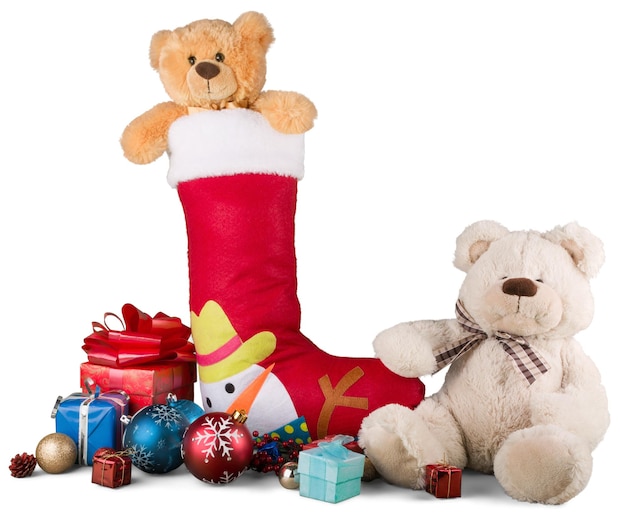 Calcetín navideño con pequeños regalos y oso de peluche