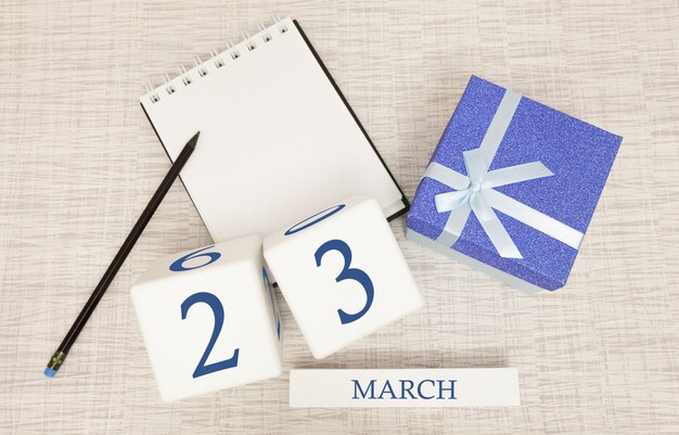 Calendário com texto azul na moda e números para 23 de março