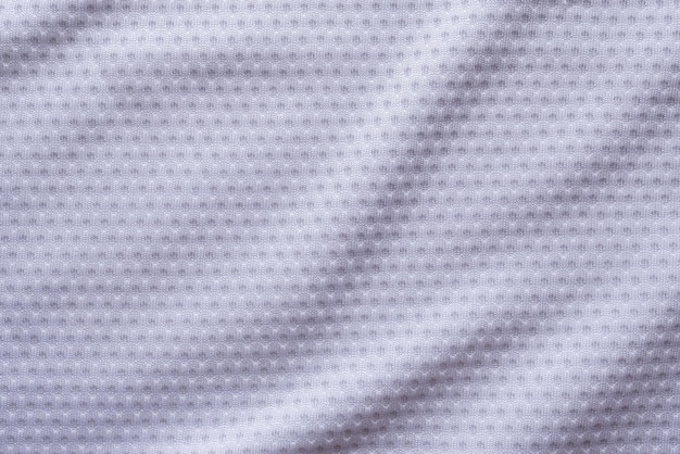Camisa de futebol de roupas esportivas de tecido branco com fundo de textura de malha de ar