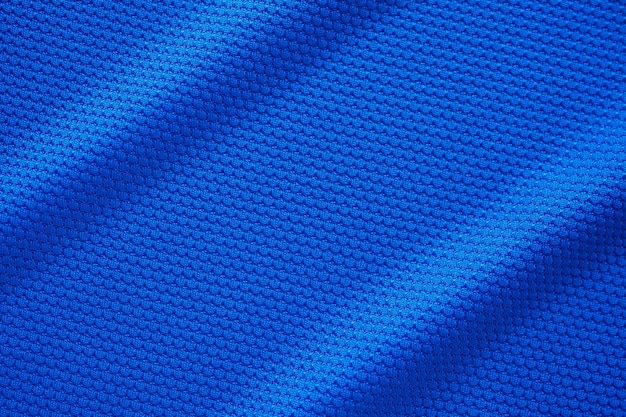 Camiseta de fútbol azul ropa textura de tela ropa deportiva fondo primer plano vista superior