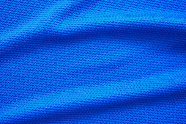 Camiseta de fútbol azul ropa textura de la tela ropa deportiva de fondo, vista superior de cerca