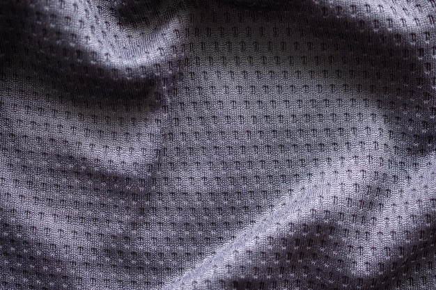 Camiseta de fútbol de ropa deportiva de tela gris con fondo de textura de malla de aire
