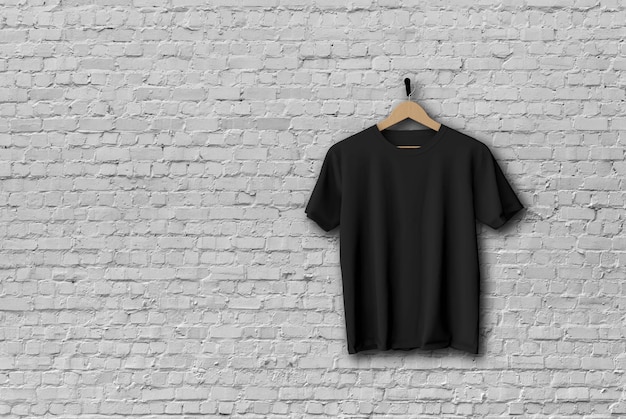 Camiseta negra simulada colgada contra una pared de ladrillos d renderizado