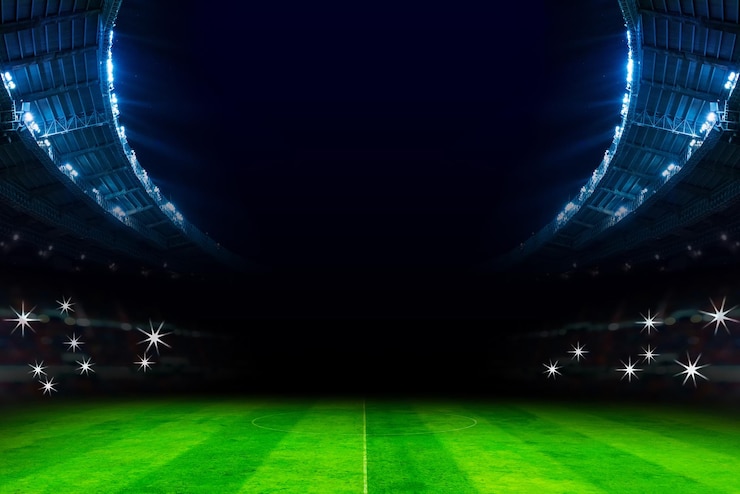 Foto campo de fútbol iluminado por la noche