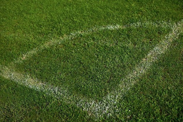 Canto do fundo de grama verde do campo de futebol