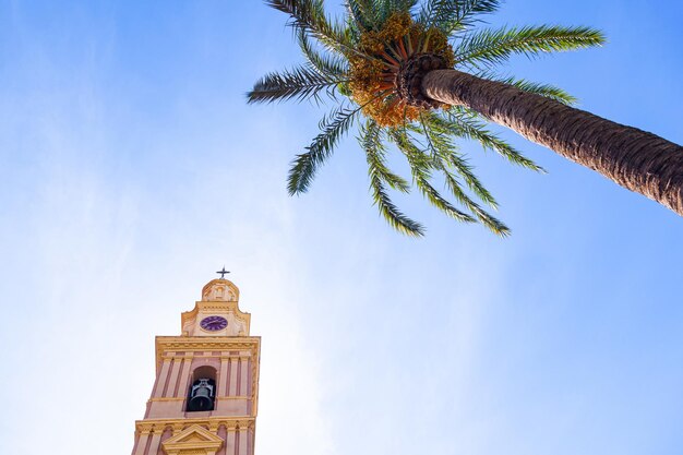 Capilla con una campana del Santuario de Nuestra Señora de la Cabeza en Motril España contra el cielo azul