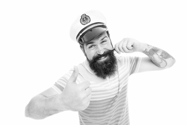 Capitán de crucero Brutal marinero aislado en blanco Concepto de capitán Bienvenido a bordo Hombre barbudo Capitán de barco Crucero marítimo Concepto de viaje Vacaciones de verano Hipster barba bigote sombrero de marinero