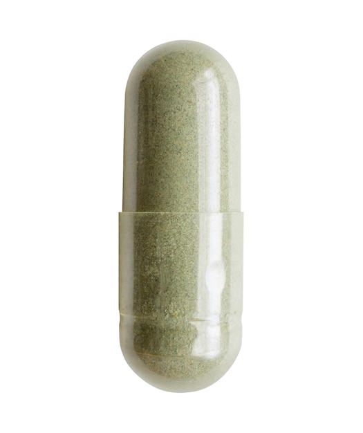 Capsula de medicina herbal aislada sobre un fondo blanco