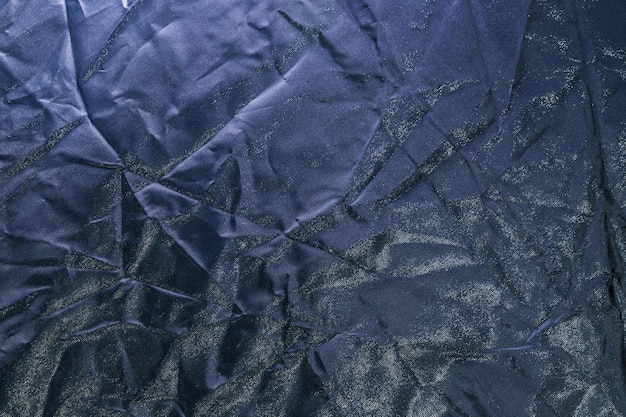 Captura aproximada de uma textura de papel amassado de cor escura