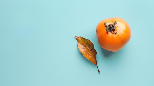 Foto el caqui es una fruta naranja redonda con un delgado tallo marrón que tiene aproximadamente el tamaño de una manzana pequeña