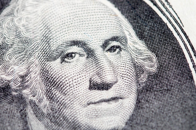 Foto la cara del presidente con un billete de un dólar