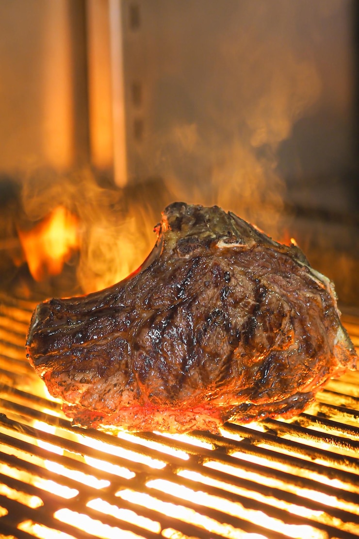 Foto carne a la brasa fuego brasas (füße an der brasa)