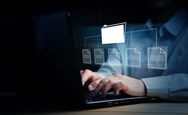 Foto carpetas con archivos en una pantalla virtual