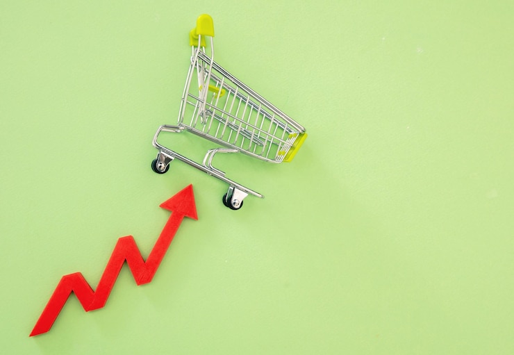 Foto carrito de compras y flecha roja hacia arriba el precio de los comestibles sube el costo del aumento de los alimentos