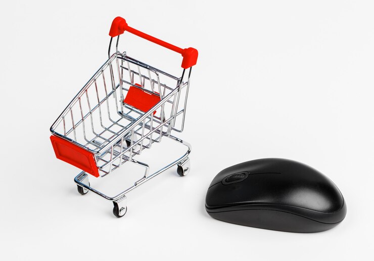 Foto carrito de compras y ratón de computadora, concepto de compras en línea