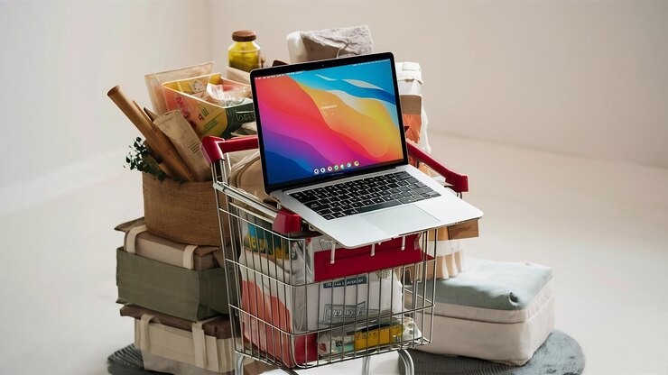 Foto carrito de supermercado en laptop