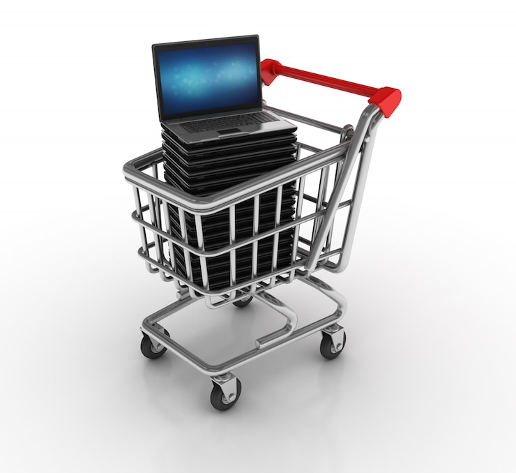 Foto carro de compras con computadora portátil
