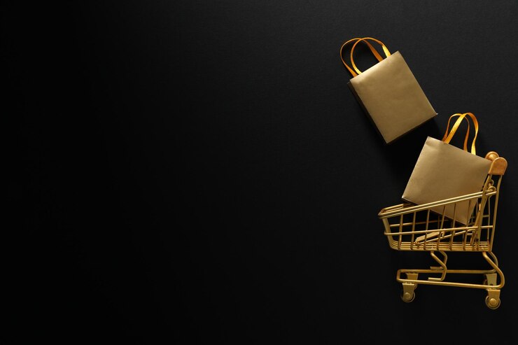 Carro de compras del concepto de viernes negro sobre fondo oscuro