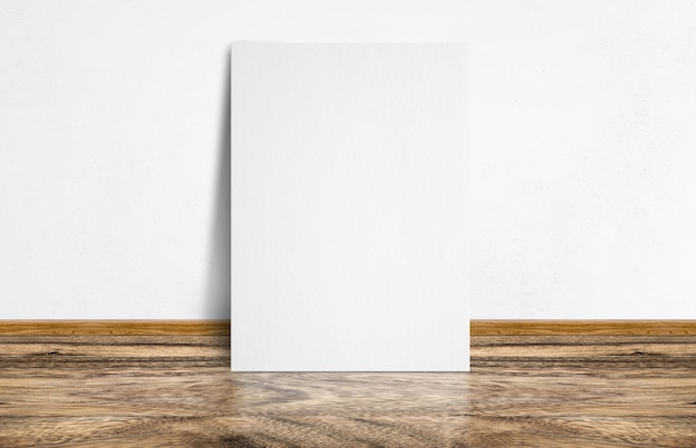 Cartaz branco encostado no piso de madeira rústico e parede branca