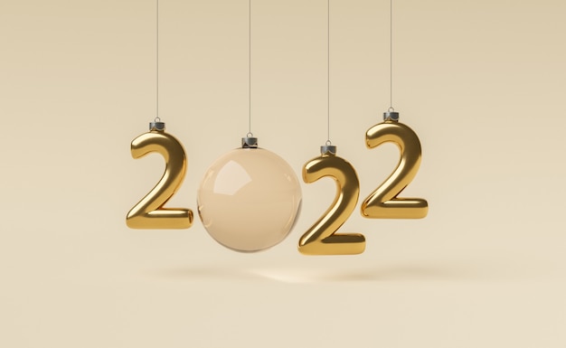 Foto cartel de año nuevo 2022 hecho con adornos navideños dorados.