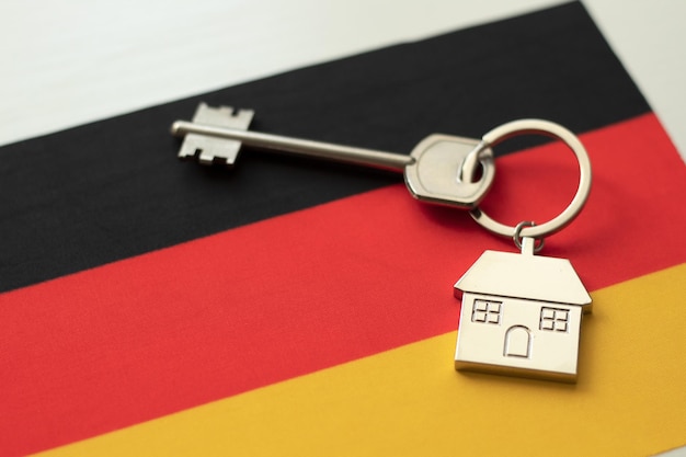 Casa con la bandera de Alemania Inmigración Compra de bienes inmuebles Casas en alquiler Precio de la propiedad Adquisición de bienes inmuebles en otro estado