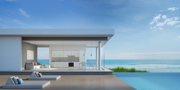 Casa de praia de luxo com piscina com vista para o mar em design moderno.