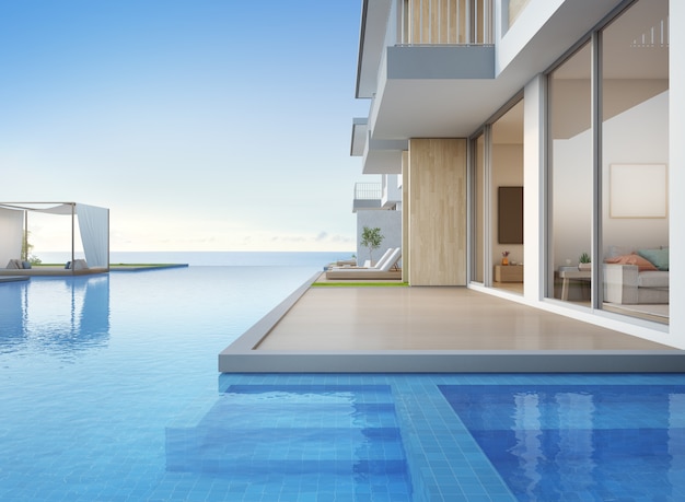 Casa de praia de luxo com vista para o mar piscina e terraço vazio em design moderno.