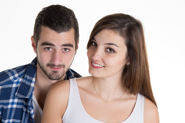 Foto casal jovem alegre dançando na decoração de hanukkah branca