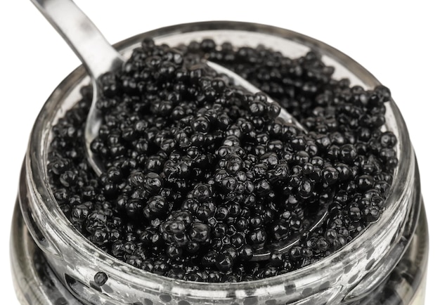 Caviar delicioso preto na jarra de vidro