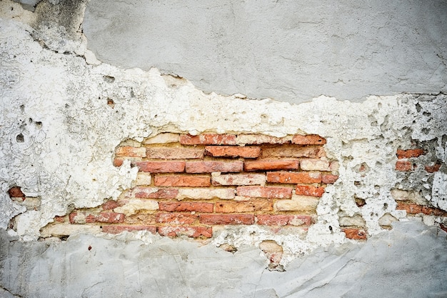 cemento agrietado de la pared de ladrillo Viejo, fondo de ladrillo vintage