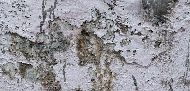 El cemento viejo lleno de manchas y rayones se puede utilizar como fondo.