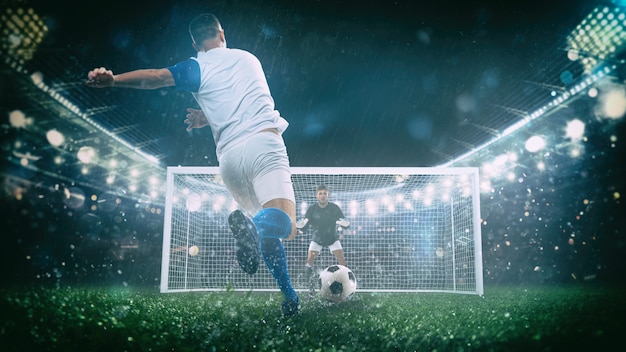 Foto cena de futebol à noite partida com jogador de uniforme branco e azul chutando o pênalti