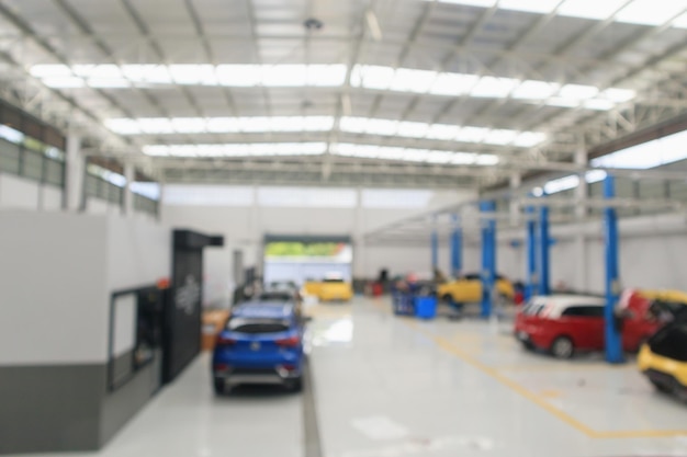 Centro de servicio de automóviles con auto en la estación de reparación bokeh luz desenfocada desenfoque de fondo