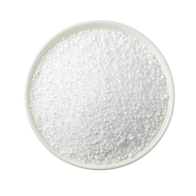 Cerca de ácido cítrico en un recipiente blanco