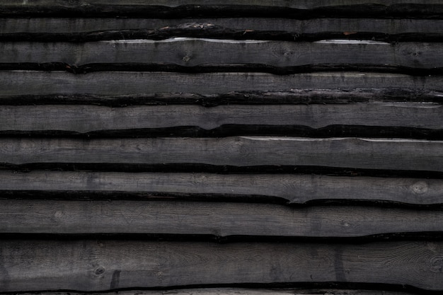 Cerca de madeira velha preta, textura de prancha, fundo