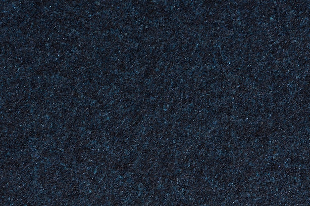 Cerca del fondo de textura de papel azul oscuro. Foto de alta resolución.