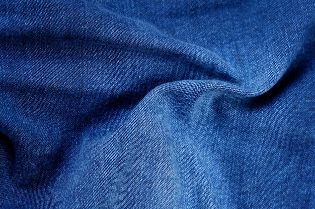 Cerca del fondo de textura de tela de jeans