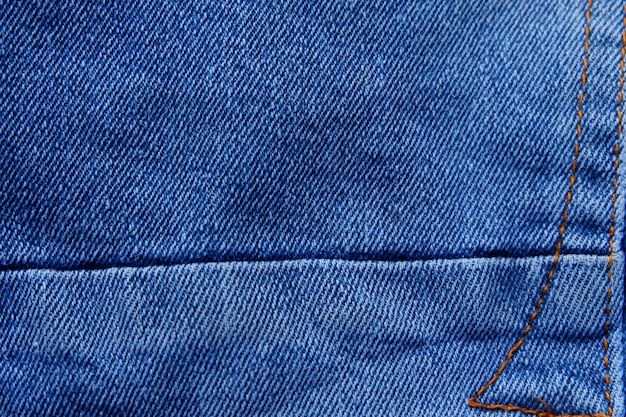 Cerca del fondo de textura de tela de jeans