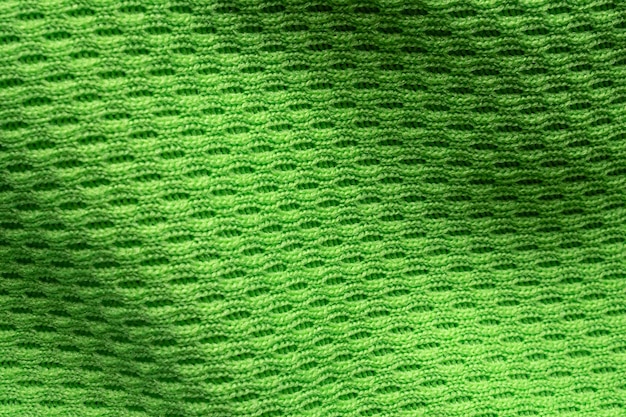 Cerca de la textura de la camiseta de fútbol verde